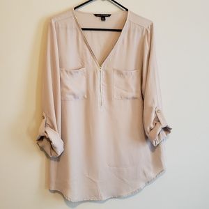 Tan zip-detail blouse with gold buttons on sleeves